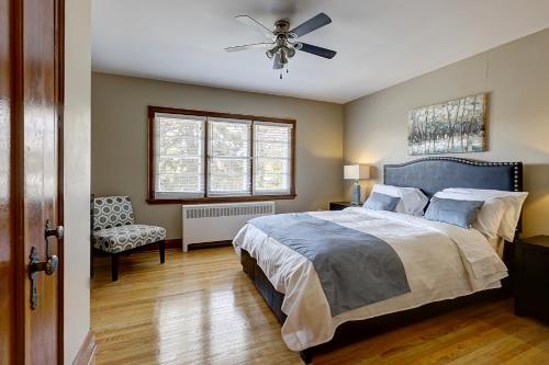 a bedroom with a bed and a ceiling fan at Parkside House in Barrie