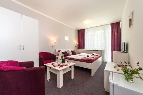 Postel nebo postele na pokoji v ubytování Hotel Racek