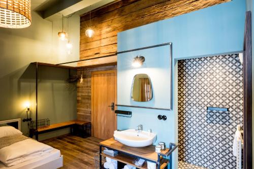 a bathroom with a sink and a mirror at Peakini Farmhaus in Untertauern