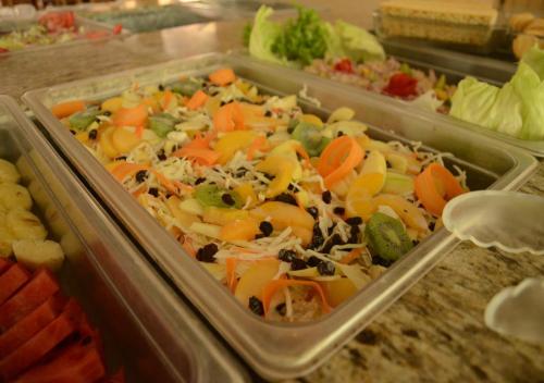 a tray of food with carrots and other vegetables at Hotel y Aguas Termales de Chignahuapan in Chignahuapan