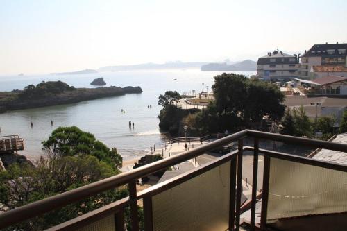 a view of a beach with people in the water at Hotel Alfar in Isla