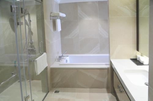 a bathroom with a shower and a sink at Dai Viet Hotel in Thanh Hóa