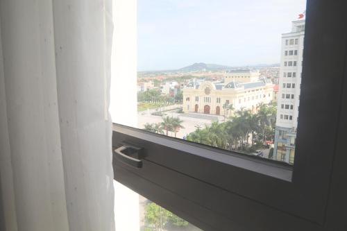 an open window with a view of a city at Dai Viet Hotel in Thanh Hóa