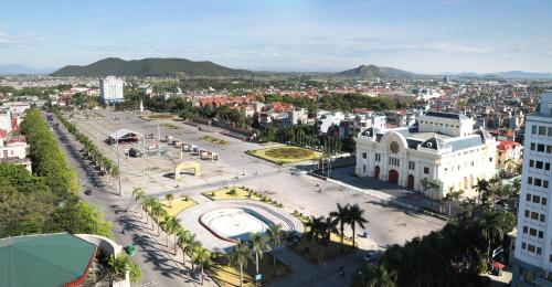 an aerial view of a city with buildings and a street at Dai Viet Hotel in Thanh Hóa