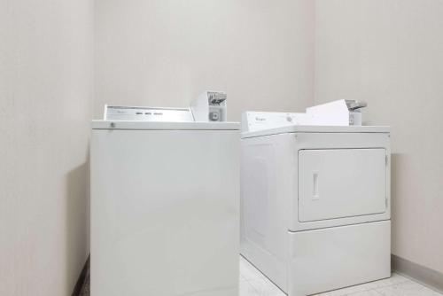 a white washer and dryer in a room at Days Inn by Wyndham Norton in Norton