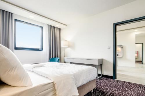 Postel nebo postele na pokoji v ubytování Park Inn by Radisson Danube Bratislava