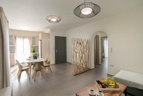 a living room with a table and a dining room at Sweet Home Naxos in Naxos Chora