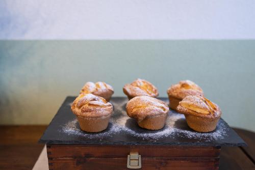 a bunch of muffins sitting on a table at I Boschetti in Magliano Alpi