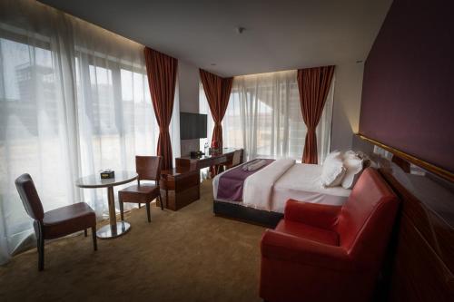 Postel nebo postele na pokoji v ubytování WIWO Hotel