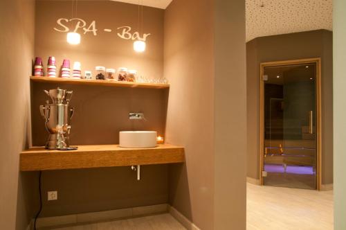 a counter in a room with a spa bar at Hotel Rosatsch in Pontresina