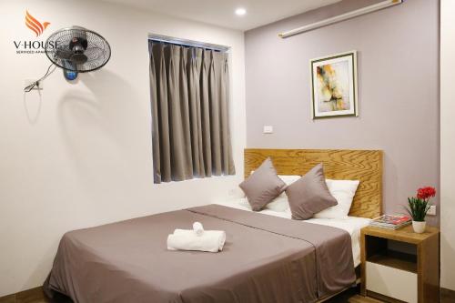 Ένα ή περισσότερα κρεβάτια σε δωμάτιο στο V House 5 Serviced Apartment