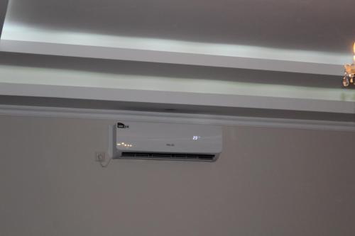 a wall mounted air conditioner on a ceiling at Villa Near The Batumi in Batumi