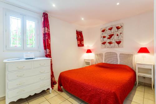 Ένα ή περισσότερα κρεβάτια σε δωμάτιο στο Hotel Villa Des Anges