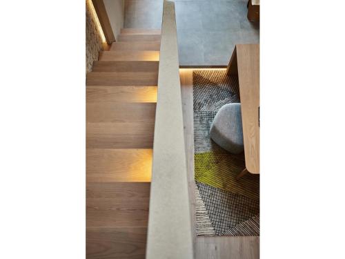 a staircase in a house with wooden floors at EBO Hotel Hangzhou Wulin - 5 mins drive to the West Lake in Hangzhou