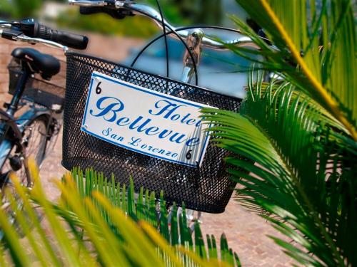 a basket on a bike with a sign on it at Bellevue San Lorenzo (Adults Only) in Malcesine