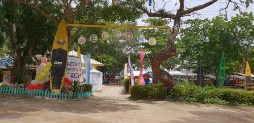 a park with a bunch of flags and balloons at Mactan Newtown Ocean View 360 Degree in Mactan