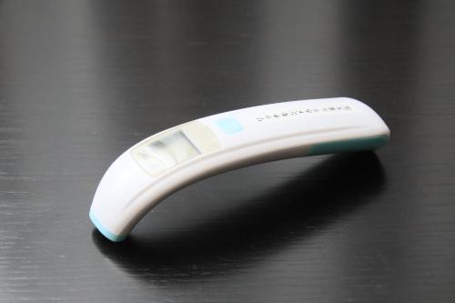 a remote control sitting on top of a table at Richmond Hotel Higashi Osaka in Osaka