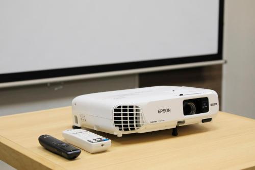 a toaster sitting on a table next to a remote control at Richmond Hotel Higashi Osaka in Osaka