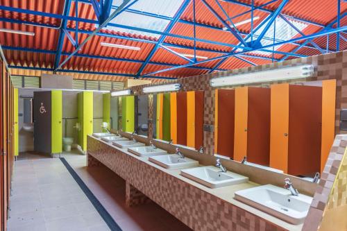 a row of sinks in a public restroom at Camping Santa Tecla in A Guarda