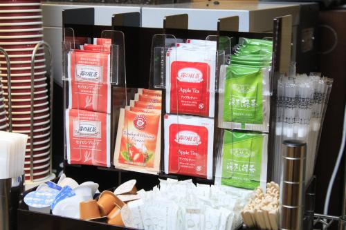 a shelf filled with lots of different types of food at Richmond Hotel Higashi Osaka in Osaka