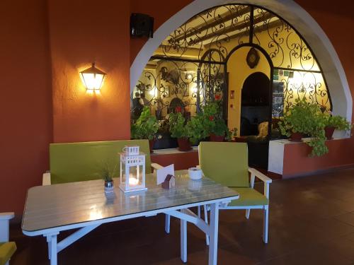 a table with a candle on it in a restaurant at Hospedium Hotel Val de Pinares in Bogarra