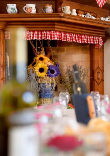 a table with a flower arrangement in a fireplace at Nadia's house in Pićan