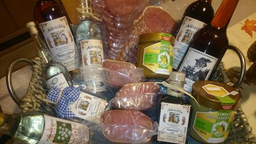 a basket full of food and bottles of wine at Landgasthof und Pension Zum löwen in Bischofsheim an der Rhön