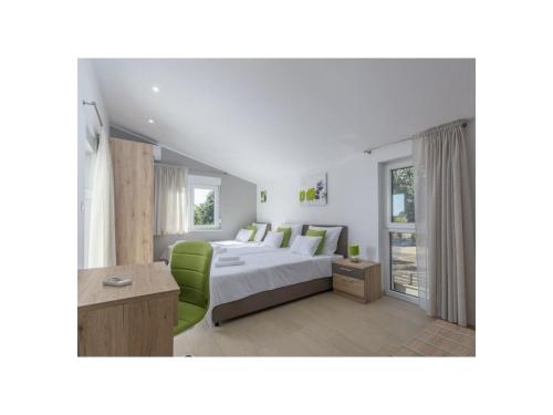 Ένα ή περισσότερα κρεβάτια σε δωμάτιο στο Villa Romi M