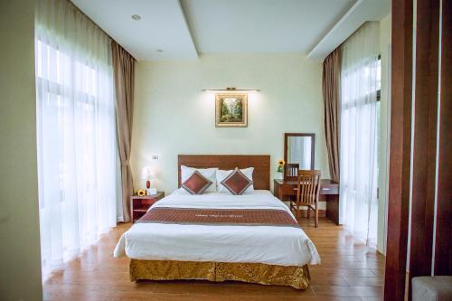 Giường trong phòng chung tại Thao Nguyen Resort Moc Chau