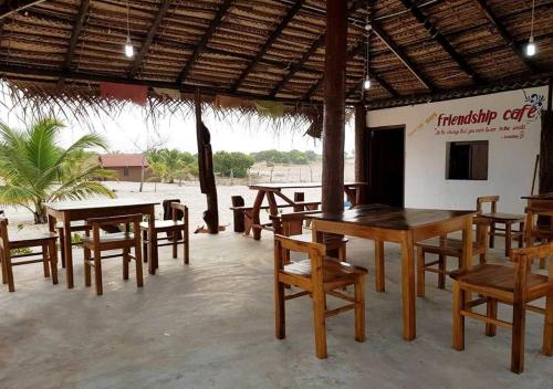 a group of tables and chairs in a restaurant at Ganesh Gate in Pottuvil