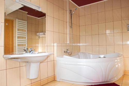 Ein Badezimmer in der Unterkunft Hotel Ambient
