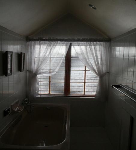 a bathroom with a window and a bath tub at Panorama Self Catering 2 in Panorama