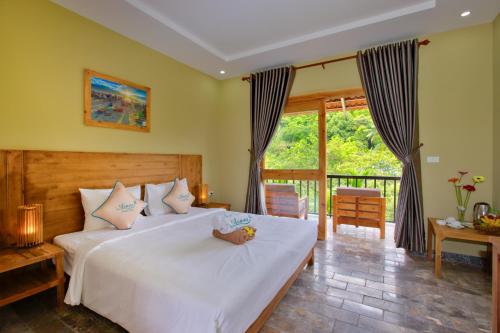 Postel nebo postele na pokoji v ubytování Azura Resort Phu Quoc
