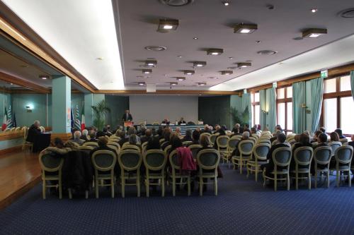 a group of people sitting in chairs in a room at 501 Hotel in Vibo Valentia