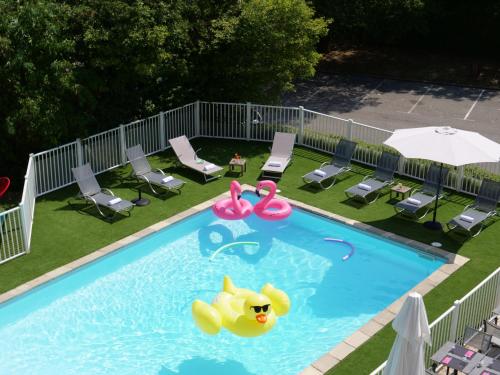 a pool with a rubber duck in the water at Mercure Annemasse Porte De Genève in Gaillard