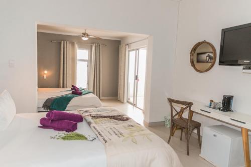 Katil atau katil-katil dalam bilik di Out of Africa Town Lodge