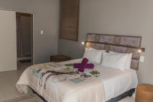 Katil atau katil-katil dalam bilik di Out of Africa Town Lodge