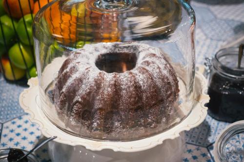 a cake in a glass jar on a table at Vienna House Easy by Wyndham Leipzig in Leipzig