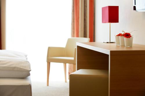 Un ou plusieurs lits dans un hébergement de l'établissement Sternen Hotel Wolfurt