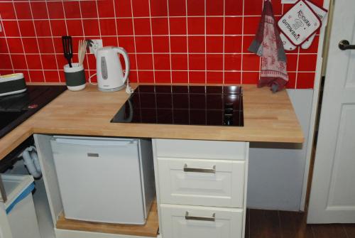 Kuchyň nebo kuchyňský kout v ubytování Grey House