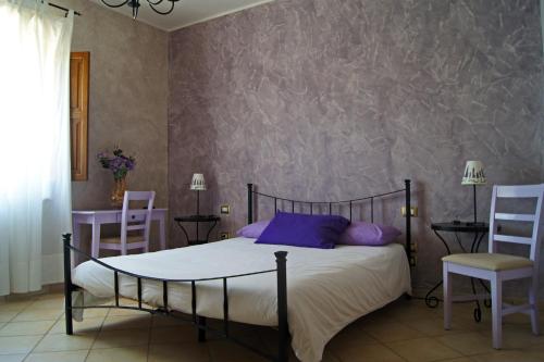 Tempat tidur dalam kamar di Agriturismo Mammarella