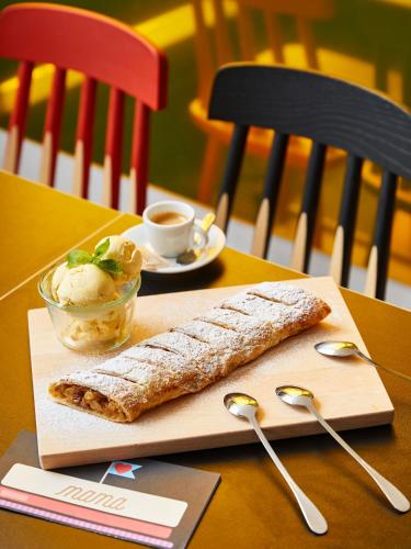 a burrito and a bowl of ice cream on a table at Mama Shelter Prague in Prague