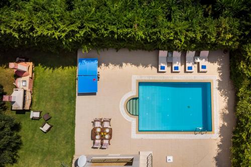 an overhead view of a swimming pool in a yard at Thelxis Villa in Lourdhata