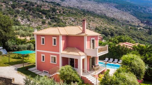 an image of a villa with a swimming pool at Thelxis Villa in Lourdhata