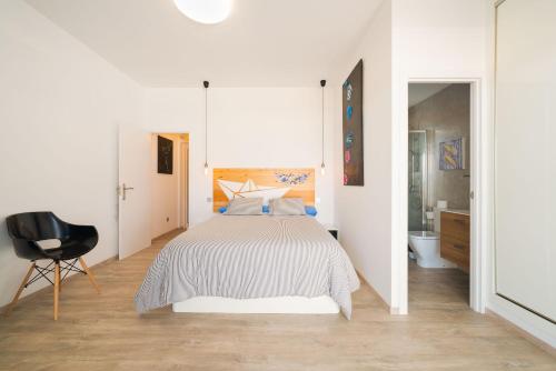 Cama o camas de una habitación en Alojamiento Santa Rosa La Graciosa
