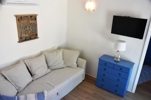 a living room with a couch and a tv at Levantara in Jezera