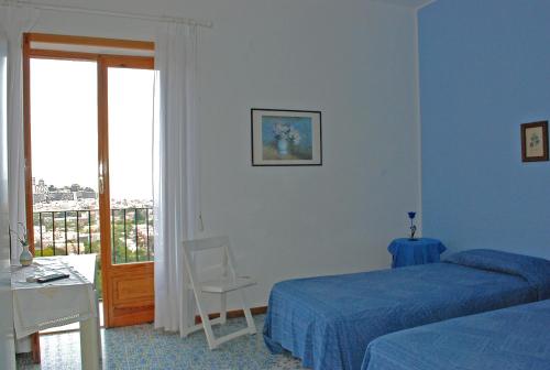 A bed or beds in a room at Costa Residence Vacanze