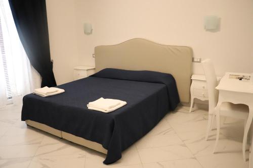 Кровать или кровати в номере Colosseo Rooms Imperial Rome