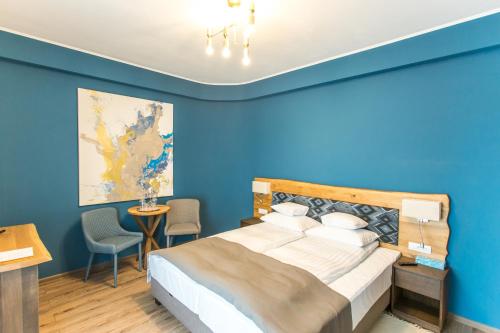 Ліжко або ліжка в номері Panorama Boutique Hotel