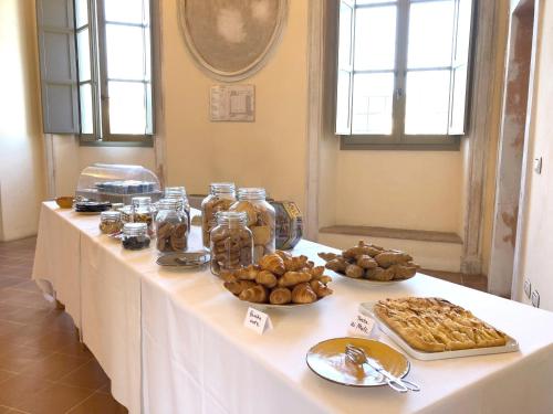 a white table with food on top of it at Antico Convento San Francesco in Bagnacavallo